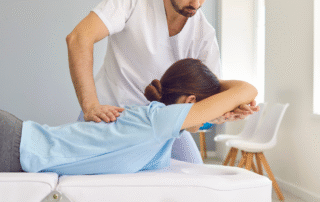 Chiropractor assessing a patient for chronic sciatica chiropractic care in Silver Spring.